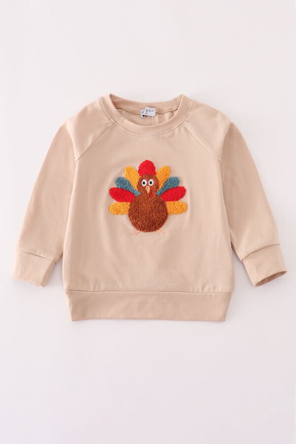Beige turkey french knot top